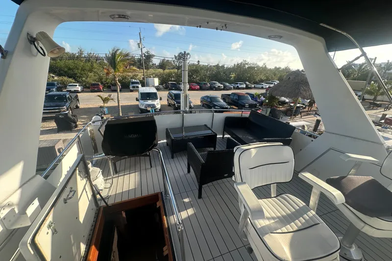 Slide: The Image of 1988 Chris Craft 46 Constellation yacht deck with seating and outdoor furniture. - 15