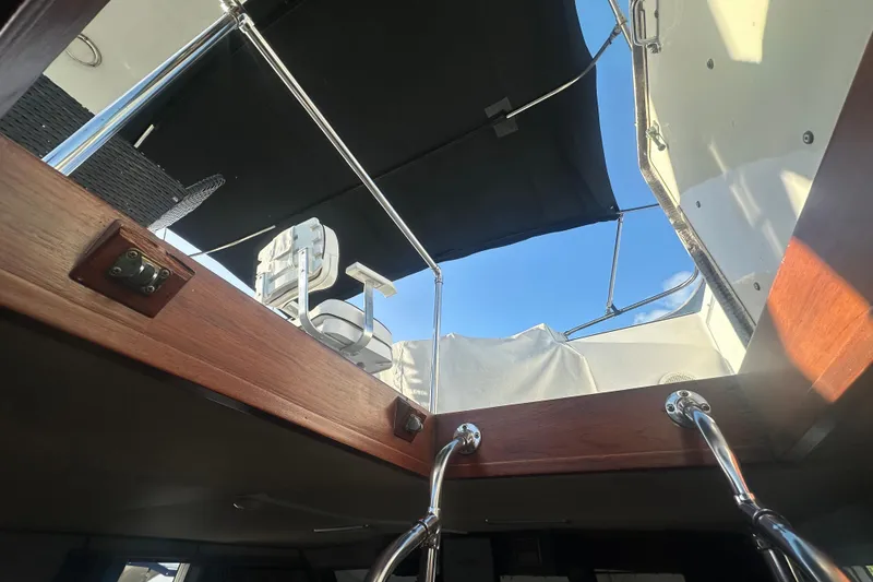 Slide: The Image of Interior view of 1988 Chris Craft 46 Constellation yacht, showcasing ladder and open hatch. - 20