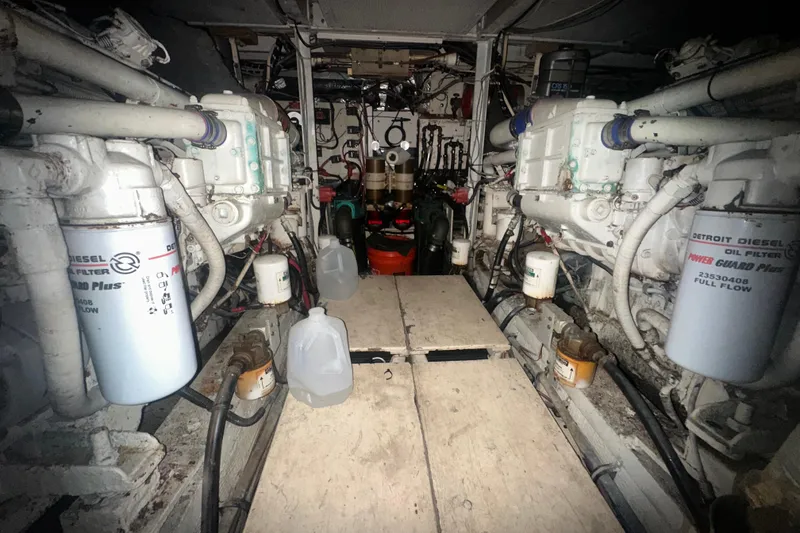 Slide: The Image of Engine room of 1988 Chris Craft 46 Constellation with Detroit Diesel filters and equipment. - 21