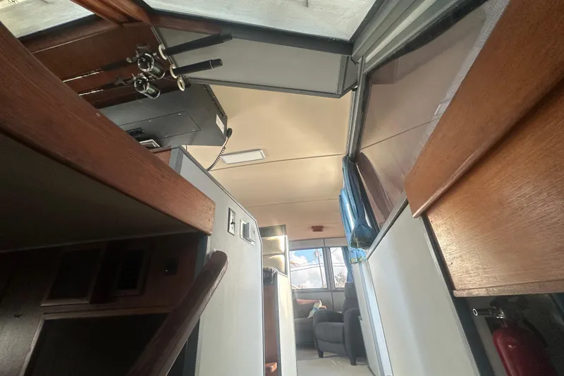 Slide: The Image of Interior view of 1988 Chris Craft 46 Constellation yacht, showcasing helm and cabin area. - 29