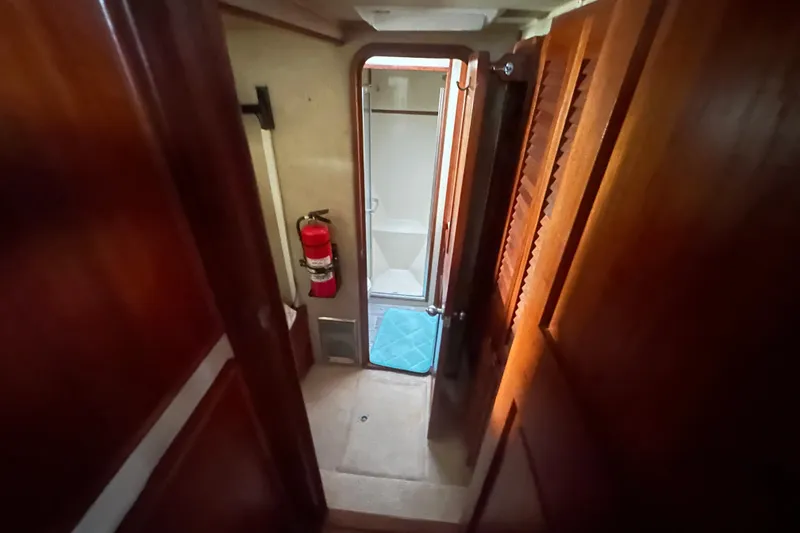 Slide: The Image of Interior view of 1988 Chris Craft 46 Constellation yacht bathroom with wooden finishes. - 37