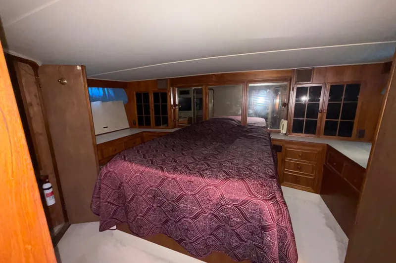 Slide: The Image of Luxurious cabin interior of 1988 Chris-Craft 46 Constellation yacht with wood cabinetry. - 41