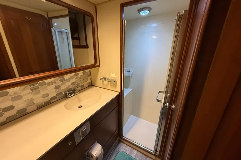 Slide: The Image of Bathroom interior of 1988 Chris-Craft 46 Constellation yacht with shower and vanity. - 45