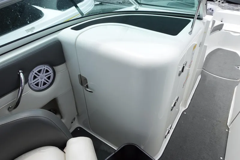 Slide: The Image of 2011 Sea Ray 260 Sundeck interior with seating and storage compartments. - 12