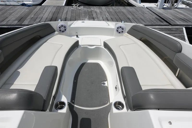 Slide: The Image of 2011 Sea Ray 260 Sundeck interior with spacious seating and cup holders. - 8