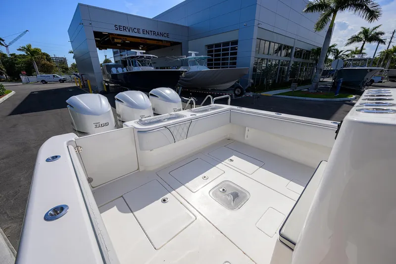 Slide: The Image of 2019 Contender 35 ST boat at service entrance with triple engines. - 11
