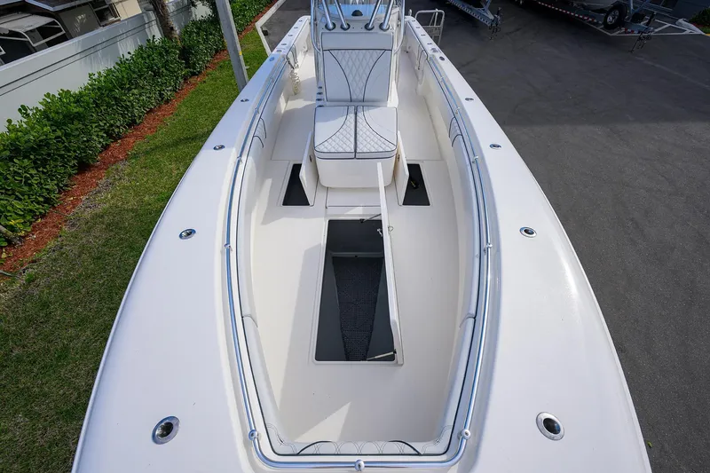 Slide: The Image of 2019 Contender 35 ST boat deck with seating and storage compartments. - 17