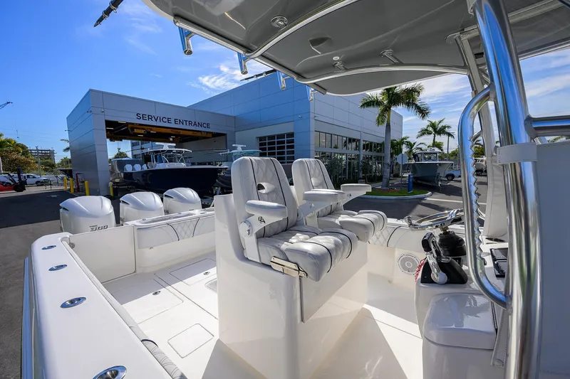 Slide: The Image of 2019 Contender 35 ST boat at service entrance, featuring sleek design and powerful engines. - 21