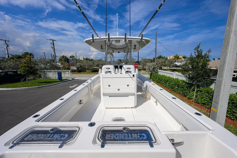 Slide: The Image of 2019 Contender 35 ST boat with spacious deck and fishing rod holders. - 25