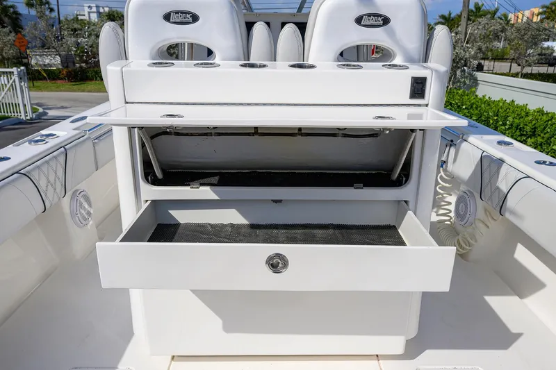 Slide: The Image of 2019 Contender 35 ST boat with open storage compartments and seating. - 26