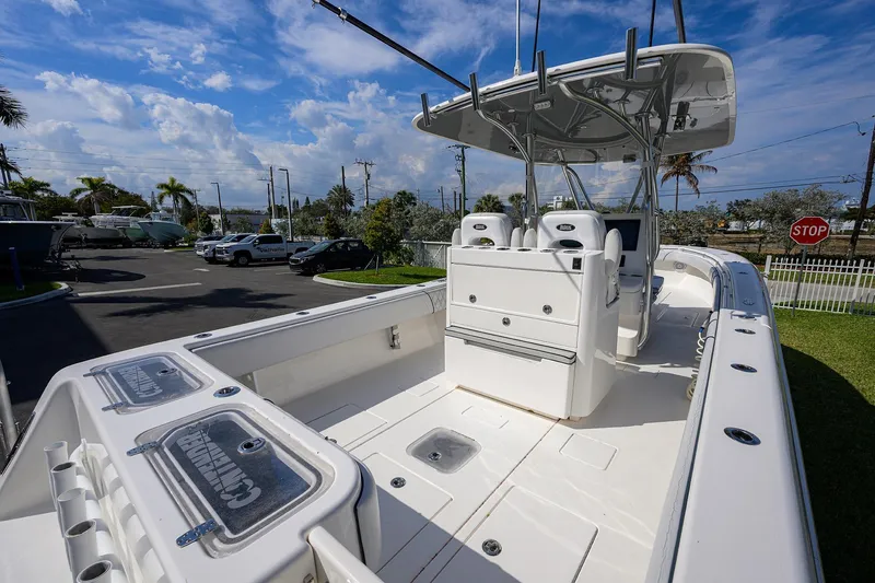 Slide: The Image of 2019 Contender 35 ST boat with spacious deck and modern console under blue sky. - 28