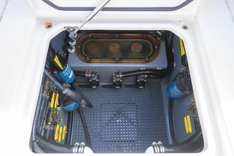 Slide: The Image of 2019 Contender 35 ST boat compartment with mechanical components and wiring. - 36