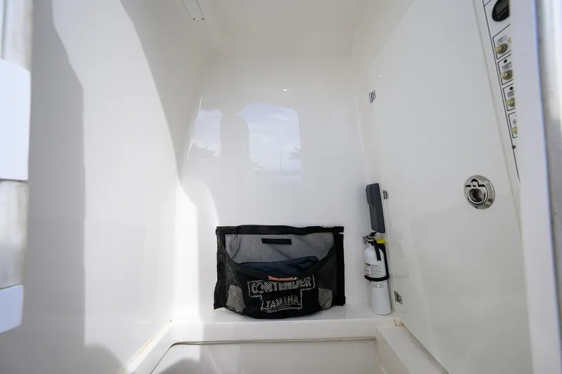Slide: The Image of Interior of 2019 Contender 35 ST boat with storage and safety equipment. - 37