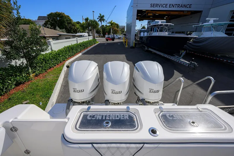 Slide: The Image of 2019 Contender 35 ST boat with triple Yamaha 300 engines at service entrance. - 39