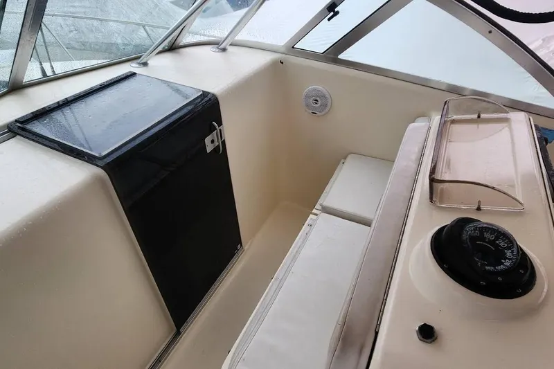 Slide: The Image of 2003 Pursuit 3070 Express boat deck with hatch and railing. - 16