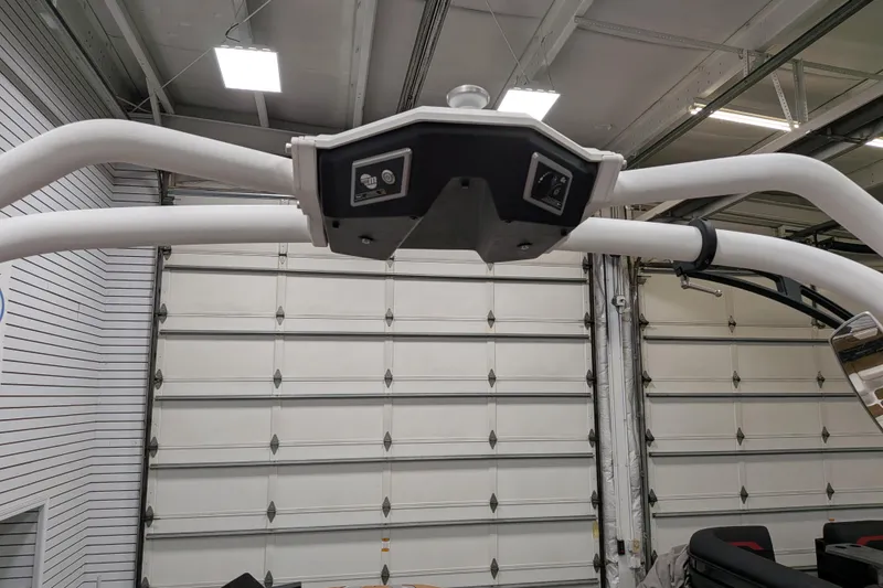 Slide: The Image of 2021 Malibu M240 boat tower in a garage setting. - 27