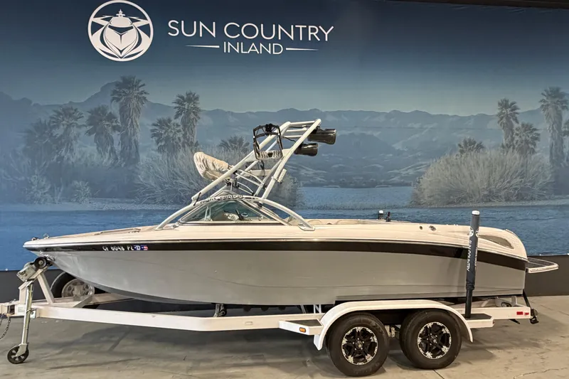 The Image of 2004 Nautique Sport Nautique SV-211 boat on trailer at Sun Country Inland showroom. - 0