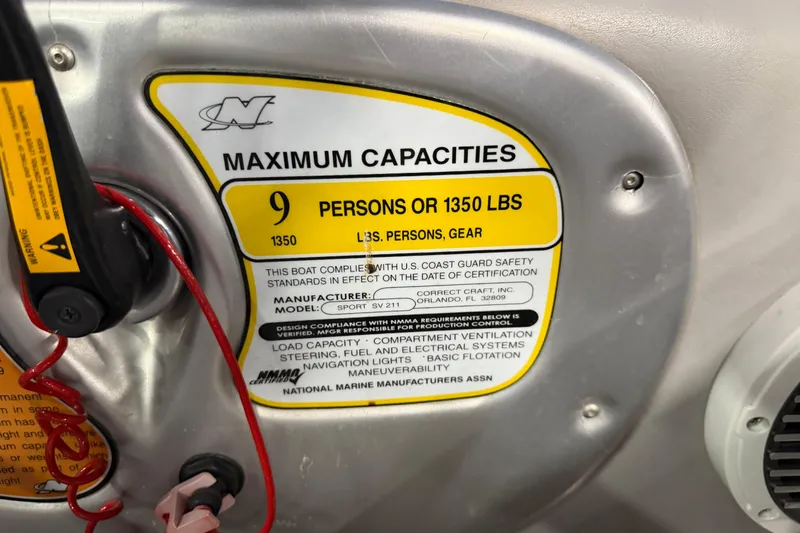 Slide: The Image of 2004 Nautique Sport Nautique SV-211 capacity label, 9 persons or 1350 lbs limit. - 19