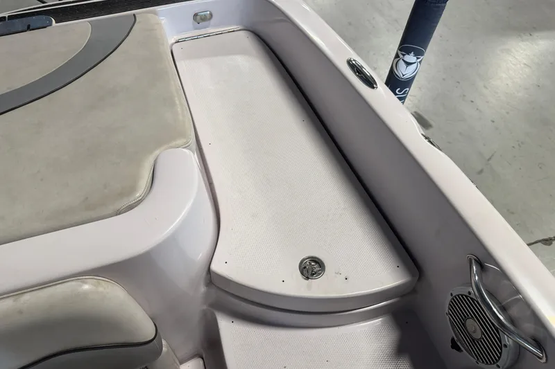 Slide: The Image of 2004 Nautique Sport Nautique SV-211 boat interior with seating and speaker detail. - 21