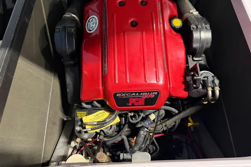 Slide: The Image of 2004 Nautique Sport Nautique SV-211 engine, PCM Excalibur 330, red cover, detailed view. - 23