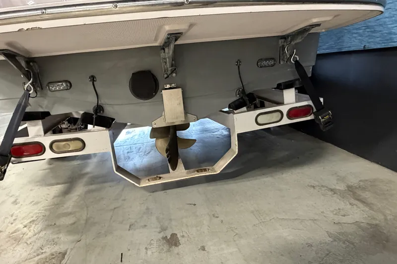 Slide: The Image of Rear view of 2004 Nautique Sport Nautique SV-211 boat on trailer, showing propeller and lights. - 3