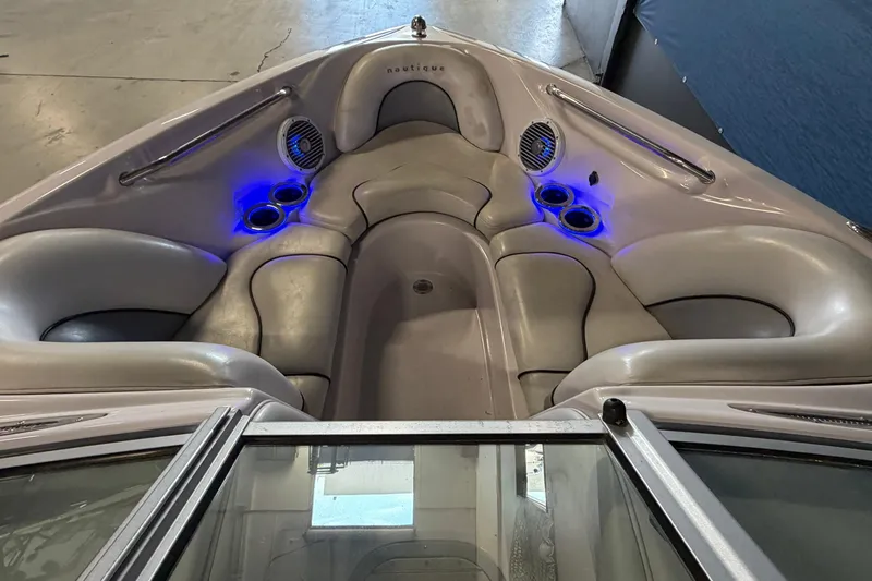 Slide: The Image of 2004 Nautique Sport Nautique SV-211 boat interior with cushioned seating and blue LED lights. - 7