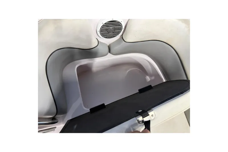 Slide: The Image of 2004 Nautique Sport Nautique SV-211 storage compartment with speaker detail. - 9