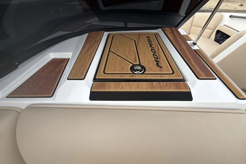 Slide: The Image of 2026 Moomba Max boat interior with wood accents and sleek design. - 18