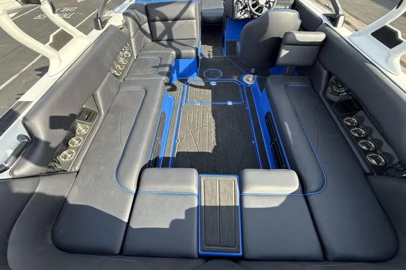 Slide: The Image of 2025 Moomba Mojo boat interior with sleek seating and modern design elements. - 10