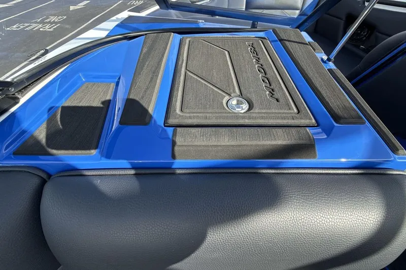 Slide: The Image of 2025 Moomba Mojo boat interior with blue and black detailing. - 18