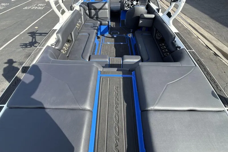 Slide: The Image of 2025 Moomba Mojo boat interior with spacious seating and sleek design. - 9