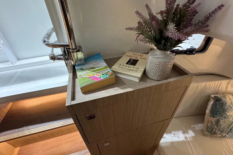 Slide: The Image of Interior of 2026 Jeanneau Leader 10.5 CC with books and decorative vase. - 13