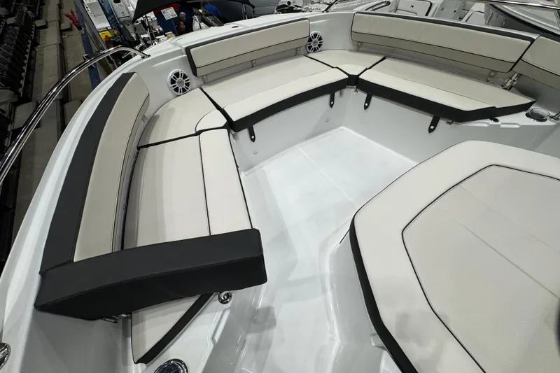 Slide: The Image of 2026 Jeanneau Leader 10.5 CC boat interior with cushioned seating and sleek design. - 18