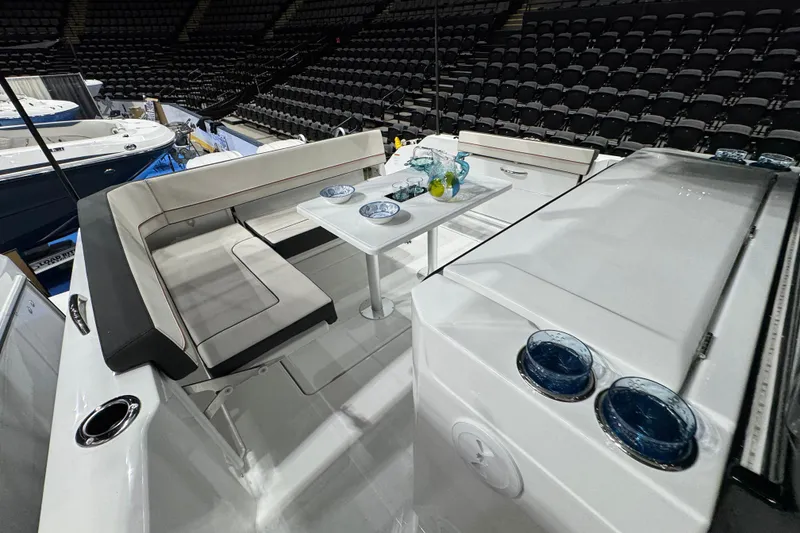 Slide: The Image of 2026 Jeanneau Leader 10.5 CC boat interior with seating and table setup. - 28