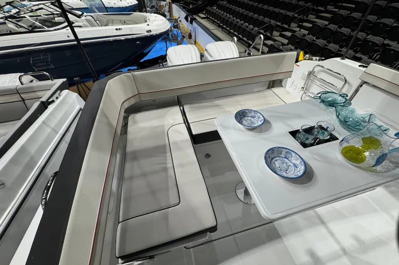 Slide: The Image of 2026 Jeanneau Leader 10.5 CC boat interior with elegant seating and dining setup. - 29