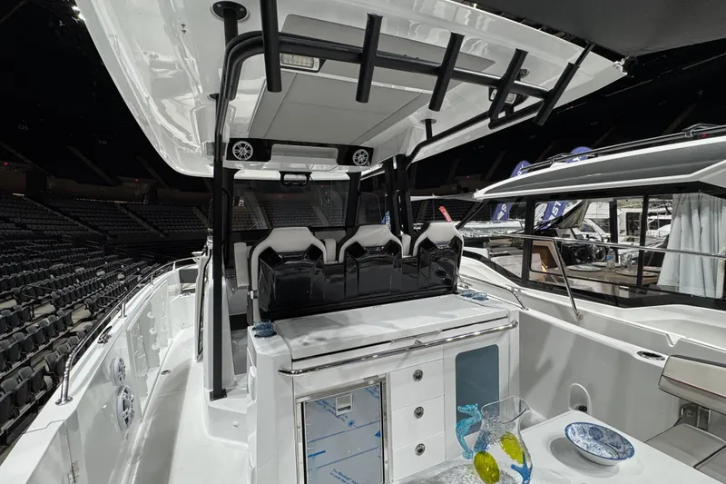 Slide: The Image of 2026 Jeanneau Leader 10.5 CC boat interior with seating and modern amenities. - 3