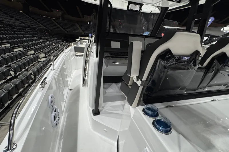 Slide: The Image of 2026 Jeanneau Leader 10.5 CC boat interior with seating and control area. - 5