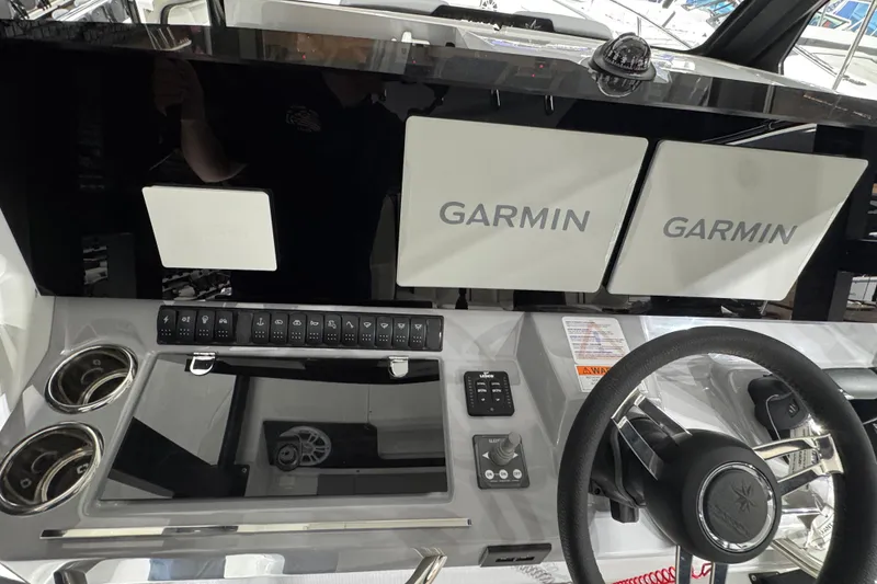 Slide: The Image of Helm of 2026 Jeanneau Leader 10.5 CC with Garmin displays and controls. - 8