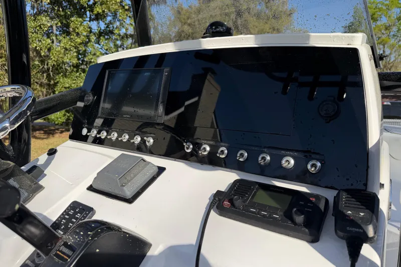 Slide: The Image of 2020 Sportsman Open 212 Center Console dashboard with navigation and communication equipment. - 11