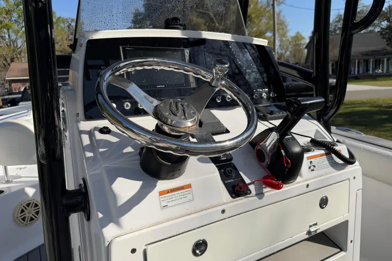 Slide: The Image of 2020 Sportsman Open 212 Center Console boat steering wheel and controls. - 7