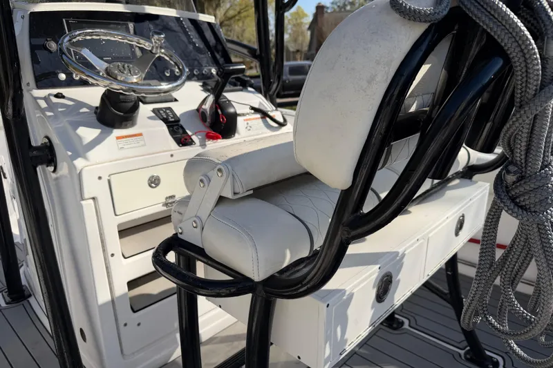 Slide: The Image of 2020 Sportsman Open 212 Center Console boat interior with steering wheel and seating. - 8