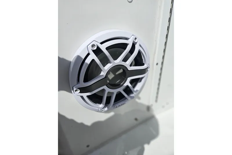 Slide: The Image of 2025 Sea Hunt Ultra 275 SE boat speaker detail, white grille design. - 14