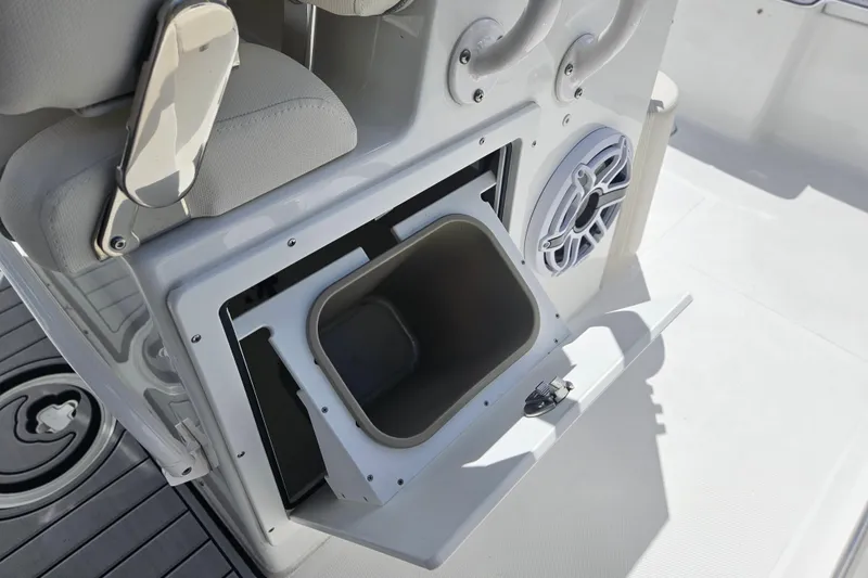 Slide: The Image of 2025 Sea Hunt Ultra 275 SE boat interior with storage compartment and speaker. - 15