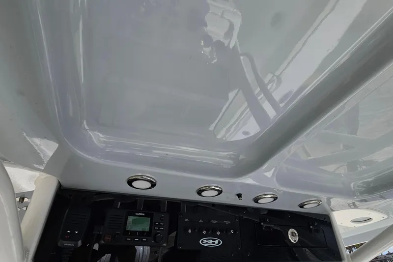 Slide: The Image of 2025 Sea Hunt Ultra 275 SE dashboard with Garmin electronics and sleek design. - 20