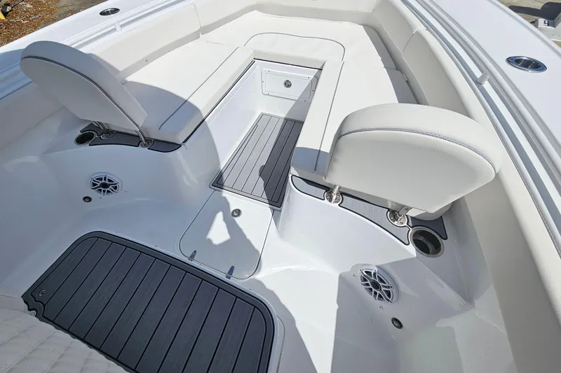 Slide: The Image of 2025 Sea Hunt Ultra 275 SE boat interior with white seating and deck features. - 22