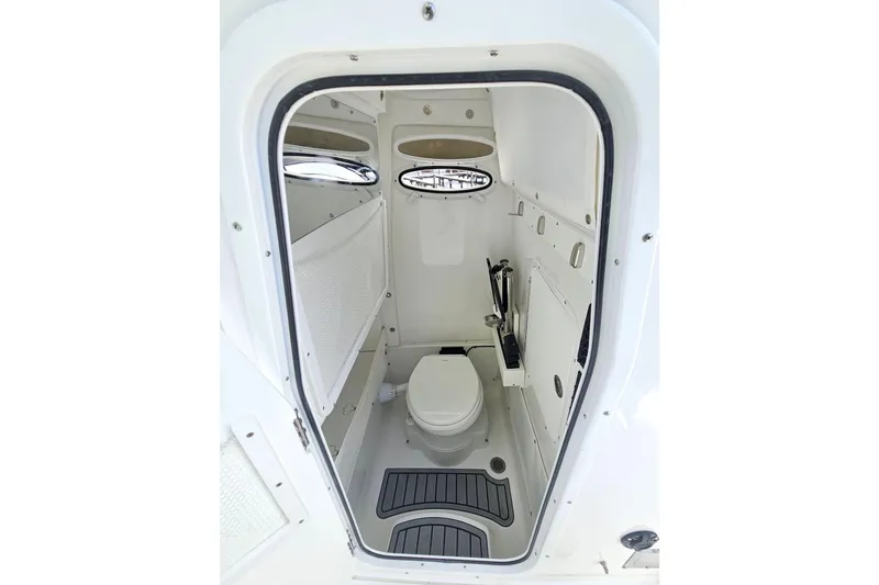 Slide: The Image of 2025 Sea Hunt Ultra 275 SE boat interior bathroom with modern amenities. - 27