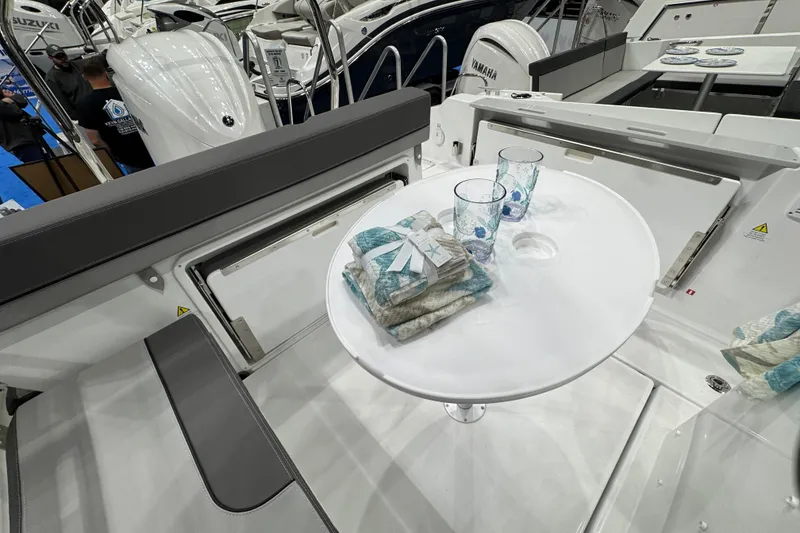 Slide: The Image of Interior of 2026 Jeanneau Cap Camarat 7.5 CC Serie 3 with table and seating. - 16