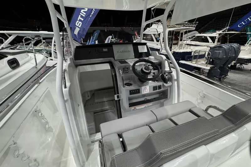 Slide: The Image of 2026 Jeanneau Cap Camarat 7.5 CC Serie 3 boat interior with modern dashboard and seating. - 3