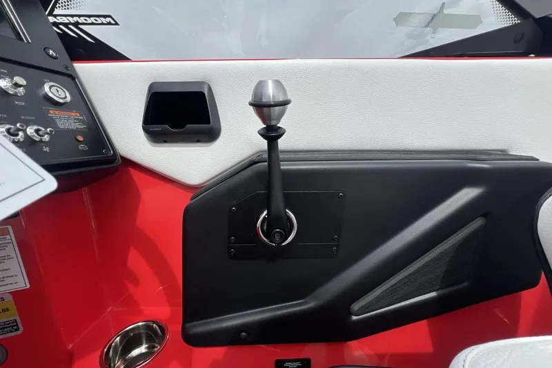 Slide: The Image of Interior of 2025 Moomba Max boat showing control panel and throttle lever. - 16