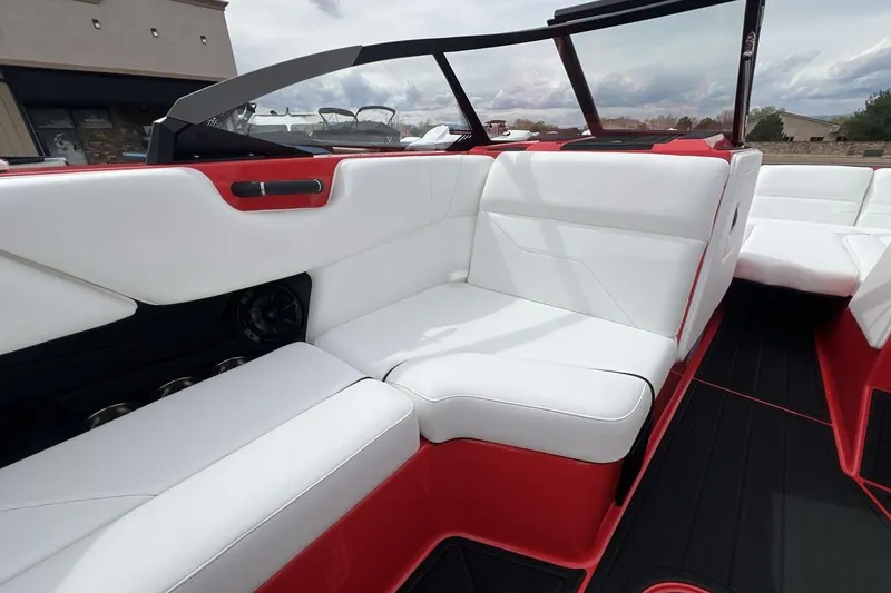 Slide: The Image of 2025 Moomba Max boat interior with white and red seating, modern design. - 17